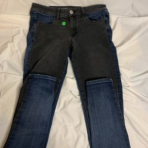 blue and black thrifted jeans